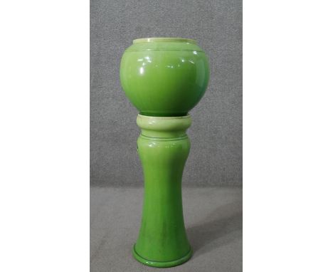 A Victorian green glazed majolica globe planter and pedestal stand. H.94 W.35cm (on stand) 