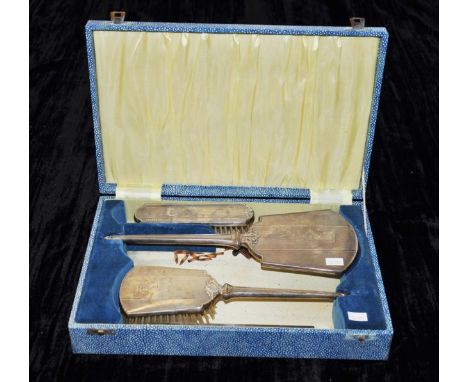 Cased 4 piece silver dressing table set comprising 2 brushes, mirror &amp; a comb, (comb as inspected), hallmarked Birmingham