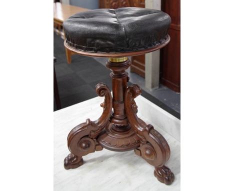 Victorian style revolving piano stool with carved tripod base
