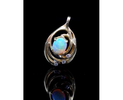 Opal and diamond set yellow gold pendant unmarked. Approx opal cabochon size 9.5mm x 7.8mm x 2.5mm deep, 3x round brilliant c