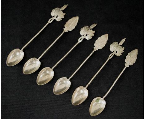 Set six Oriental silver coffee spoons each with decorative finial.