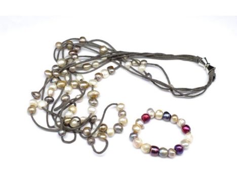 Freshwater cultured pearl necklace and bracelet the multi strand necklace is unmarked Jan Logan threaded on suede cordage and