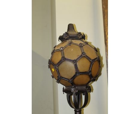 AN UNUSUAL BARONIAL STYLE SIDE LIGHT, iron work globe top with horn plates on velvet and studded pole, H 220 cm