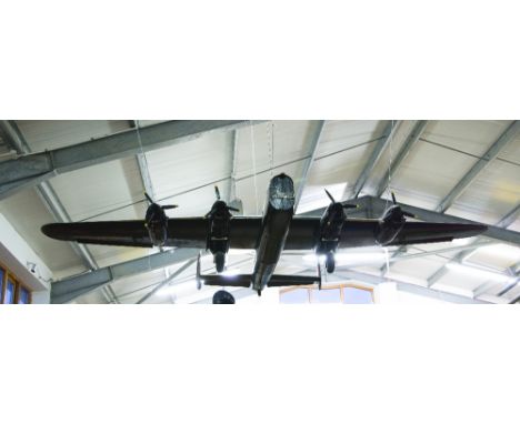 A LARGE SCALE MODEL OF AN AVRO LANCASTER BOMBER TOGETHER WITH A DE HAVILLAND MOSQUITO, the Lancaster painted black with wheel