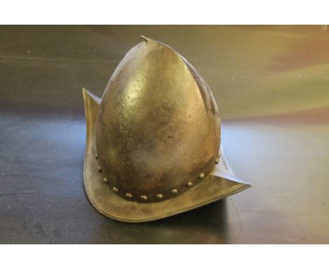 A MORION CABASSET HELMET IN 17TH CENTURY STYLE (19th/20th century origin) with pointed brim and stud decoration, H 24 cm