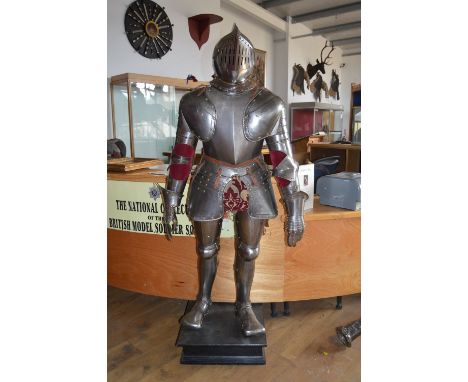 A FULL SUIT OF COMPOSITE ARMOUR 16TH CENTURY AND LATER, in bright steel, comprising a close helmet, skull rising to a pronoun