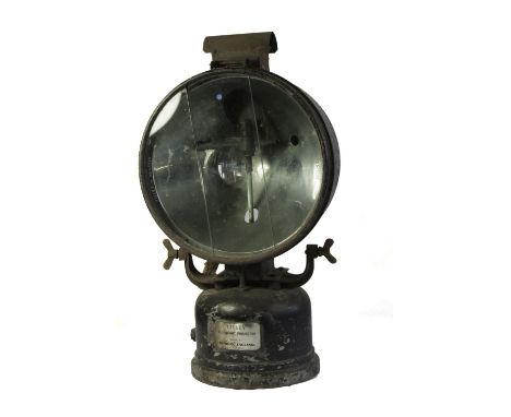 A LARGE BLACK PAINTED 'TILLEY FLOODLIGHT PROJECTOR' with three piece sectional glass lens and brass maker's plate, W 67 cm