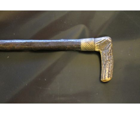 A LARGE BRASS COLLARED WALKING STICK, with antler handle, natural unworked staff which has been lacquered and fitted with a b