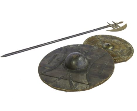 TWO SCOTTISH TYPE SHIELDS, the larger with domed central boss and iron strapwork, the smaller with hide cover and stud work, 