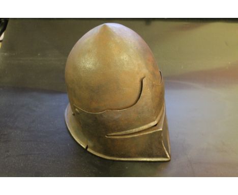 A 16TH CENTURY STYLE JOUSTING HELMET with single eye slit visor, 19th/20th century origin, H 26 cm