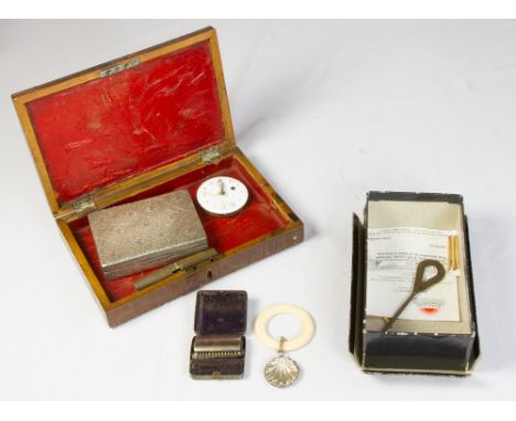 TWO SMALL BOXES CONTAINING A SELECTION OF COLLECTABLES, to include a pocket watch movement, caddy spoon, button hook etc.