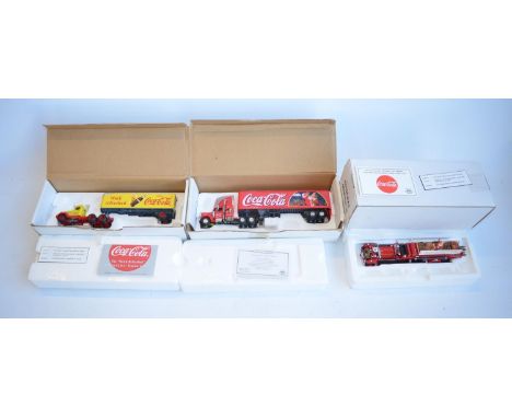 Three Matchbox Collectibles diecast models to include 1/58 scale DYM38050 Coca-Cola "Work Refreshed" Peterbilt cab with trail