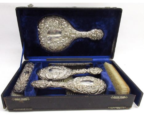 Cased Edwardian silver vanity travel set with mirror, four brushes &amp; comb, cased in a blue velvet interior, Birmingham, 1