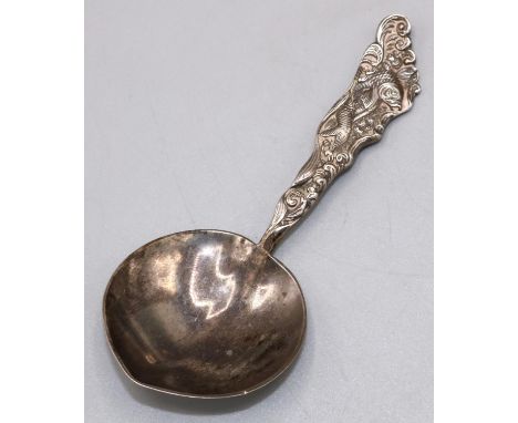Silver tea caddy spoon, American, by Gorham Heart shaped bowl, tapered handle cast with a fish within scroll decoration, 0.5o
