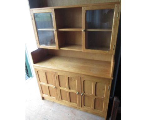 Yorkshire oak style light oak dresser, raised three shelf back with two glazed doors, the base with four panel doors, W123cm 