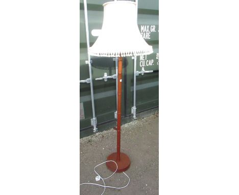 Teak floor lamp, bamboo turned column on circular base, with fringe shade 