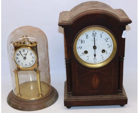 Junghans retailed by Benjamin Harral Barnsley early C20th inlaid oak mantel clock with two train movement striking on a scrol