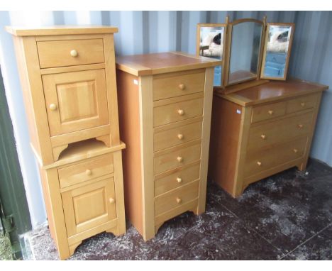 Suite of modern light wood bedroom furniture comprising of kneehole dressing table, chest of two short above two long drawers