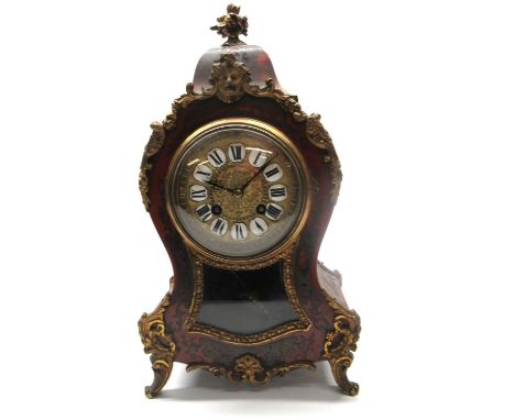 C20th French red Boulle mantel clock, waisted case with applied cast brass mounts, brass bezel enclosing cast brass dial with