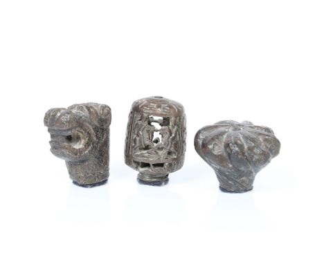 THREE MEDIEVAL BRONZE MACE HEADS (3). The first modelled as an open mouthed hound with scroll ears and large teeth, 50mm high