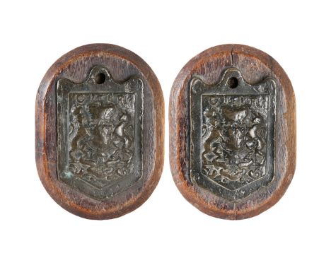 A RARE PAIR OF GEORGE III BRONZE WOOL WEIGHTS. Cast in bronze at 7lb, GIII and crest, stamped to the edge, both later mounted