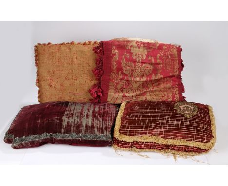 Collection of cushions, to include an 18th Century red velvet fitted seat cushion with a silver wirework thread, 55cm diamete