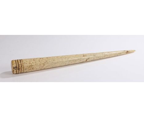George III whalebone fid, with a ring turned top and tapering body finished with a point, 39cm long