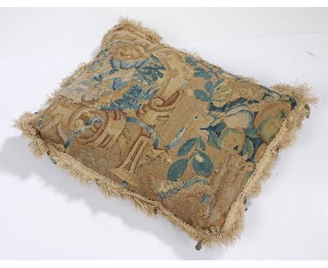 17th Century tapestry cushion, with a scroll and flowers surrounding fruit, 40cm diameter 