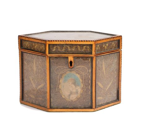 George III satinwood and scrollwork tea caddy, late 18th Century, with glazed panels decorated with paper and gilt rolled pap