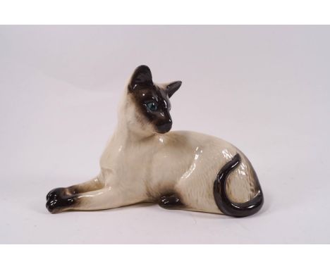 A Doulton figure of a Siamese cat, printed factory marks, model No 1558