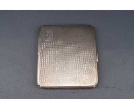 A silver engine turned oblong cigarette case with script initials 'SM', Birmingham 1941 by Suckling Ltd, 9.5cm x 8.5cm, 139g,