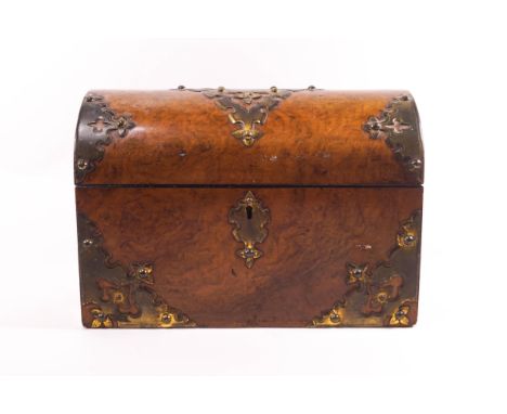 A 19th century walnut dome top tea caddy with Gothic style brass mounts, the interior with two lidded compartments, 25.5cm wi