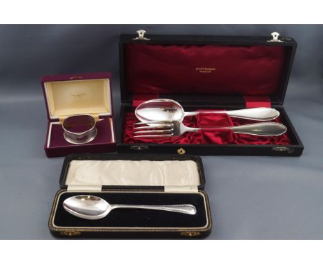 A small group of silver, comprising; a tea spoon with a reed and ribbon border, Birmingham 1932, 23g, in a fitted case; a sil