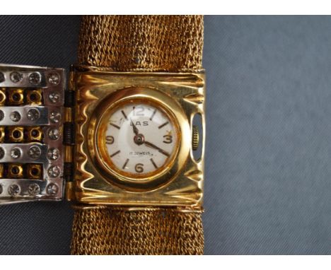 Las/ Delbana Watch, a lady's Swiss ruby and diamond bracelet watch, round silvered dial with raised gilt Arabic numerals and 
