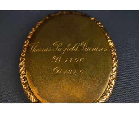 An early 19th century portrait miniature of Thomas Pasfield Davidson, watercolour, within a part- floral chased gold-plated f