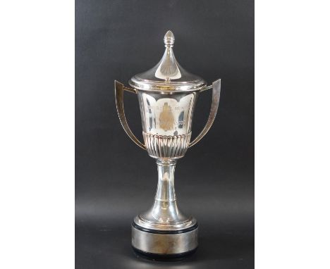 The Royal Hunt Cup, Royal Ascot 2014, a silver trophy cup and cover, with two swept-scroll handles, part fluted on a round fo