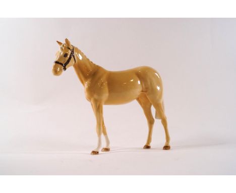 A Beswick model of a Palomino show pony, modelled by Shane Ridge, printed factory mark, 17cm high, boxed