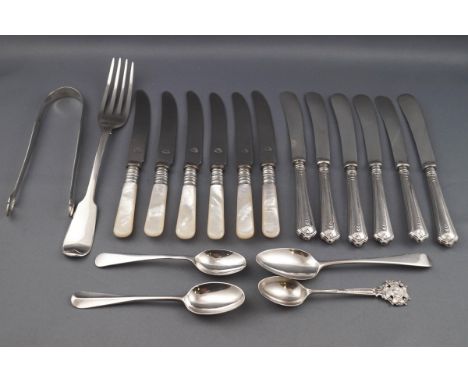 A collection of tea knives and silver flatware, comprising; a George III bright-cut engraved sugar tongs, maker's mark and li