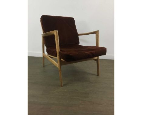 STEFAN, POLISH TEAK LOUNGE CHAIR, CIRCA 1950-59 with shaped armrests, gate back, on tapered supports, brown dralon upholstere