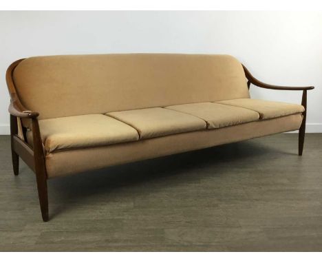 GREAVES & THOMAS OF LONDON, TEAK SOFA BED, CIRCA 1960-69 with swept arms and raised on tapered supports, upholstered in dralo