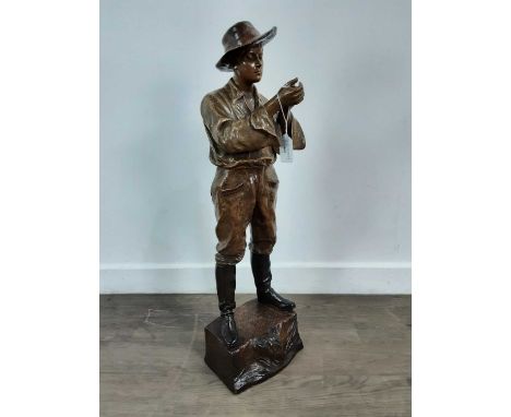 CHERC FOR GOLDSCHEIDER, 'GAUCHO' -  A PATINATED TERACOTTA FIGURE, CIRCA 1900 modelled as a cowboy lighting a pipe, raised on 