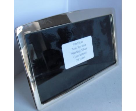 A boxed Cabani .925 silver landscape photo frame, 18 x 10 cm, on polished, wood-effect easel support