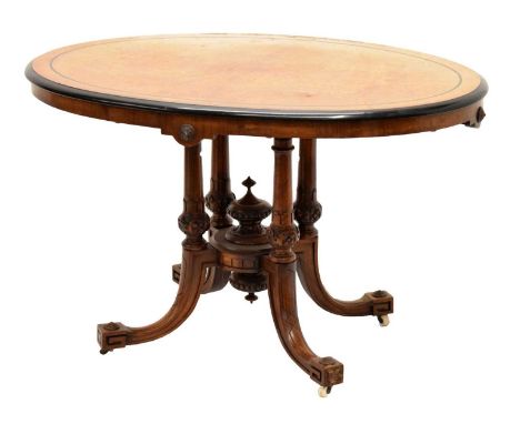 Late Victorian walnut and ebonised loo table, raised on four downswept supports on ceramic castors, 113cm x 82cm x 70cm high