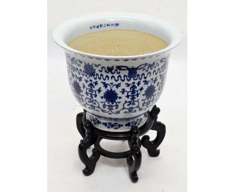 Large Chinese Ming-style blue and white jardiniere or planter 57.5cm diameter x 45cm high, on an ebonised stand