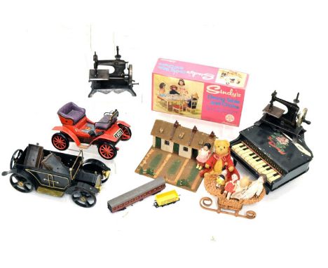 Mixed group of vintage toys to include; Japanese tinplate motorcar, two miniature sewing machines, boxed Sindy's Dining Table