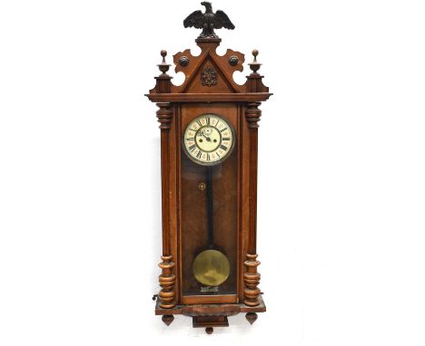 Vienna style wall clock with cream chapter ring Roman dial and eagle finial to top, 126cm high, with pendulum  