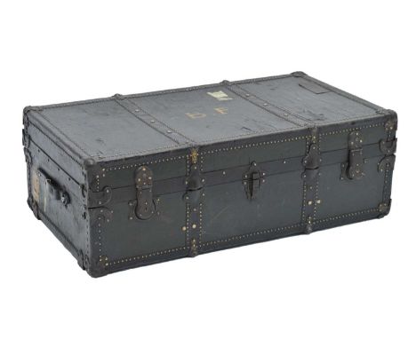 Green and metal bound studded travelling trunk, with painted B.F. initialling to top, with remains of past railway labels, 10