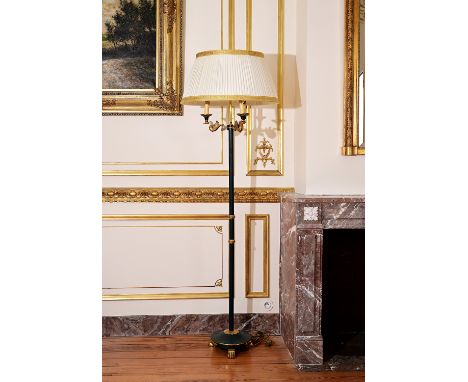 An Empire style floor lamp on three lion paws with three light points carried by swans, 20th C.H 183 cm (with shade)