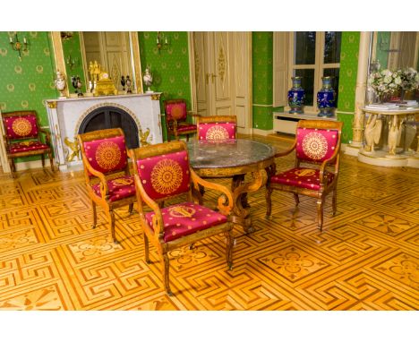A round mahogany Charles X table on four lion legs with incrustation and a rouge belge marble top, first third 19th C.H 78,5 