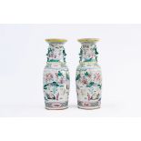A pair of Chinese famille rose vases with immortals, 19th C.